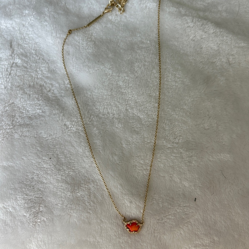 Elegant Gold Necklace with Orange Pendant